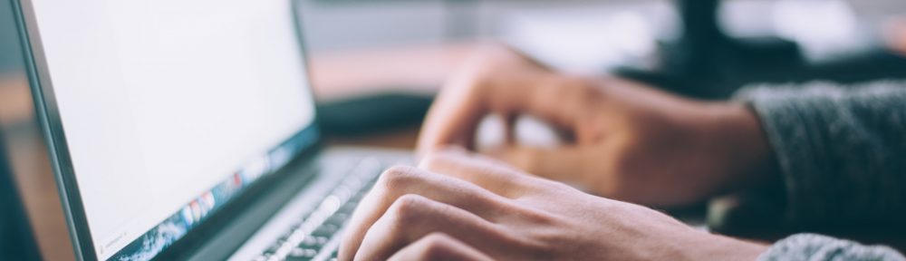 Man typing on laptop